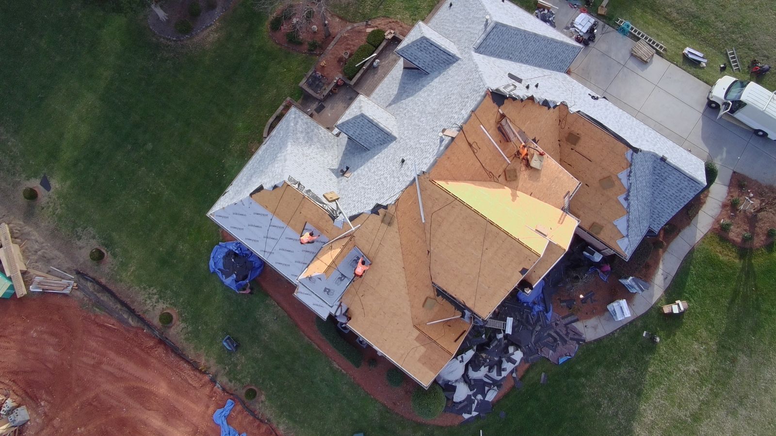 Roof mid-install, half torn off and half new